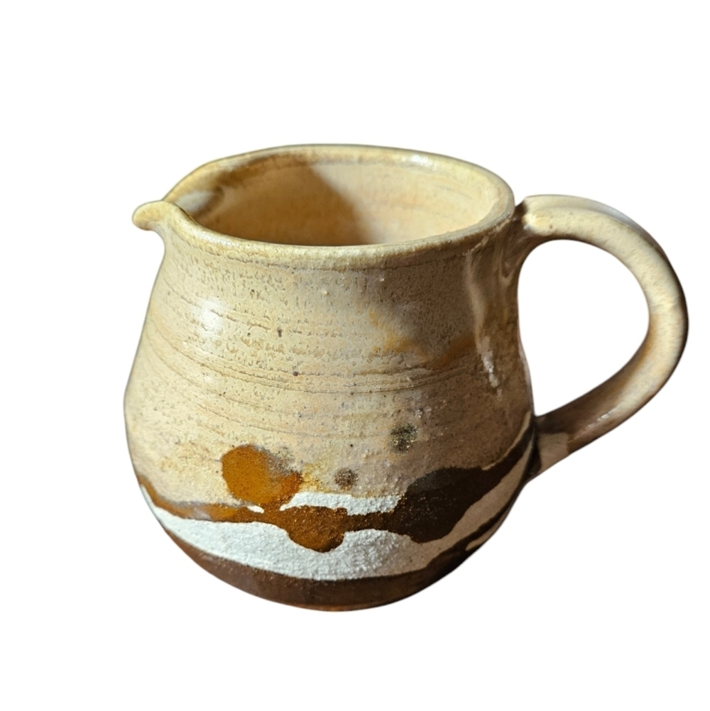 Vintage studio art pottery pitcher signed.